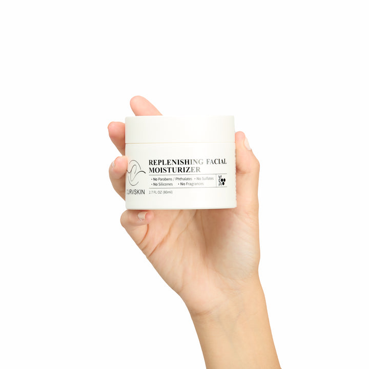 Curv Skin Replenishing Facial Moisturizer held in a hand.