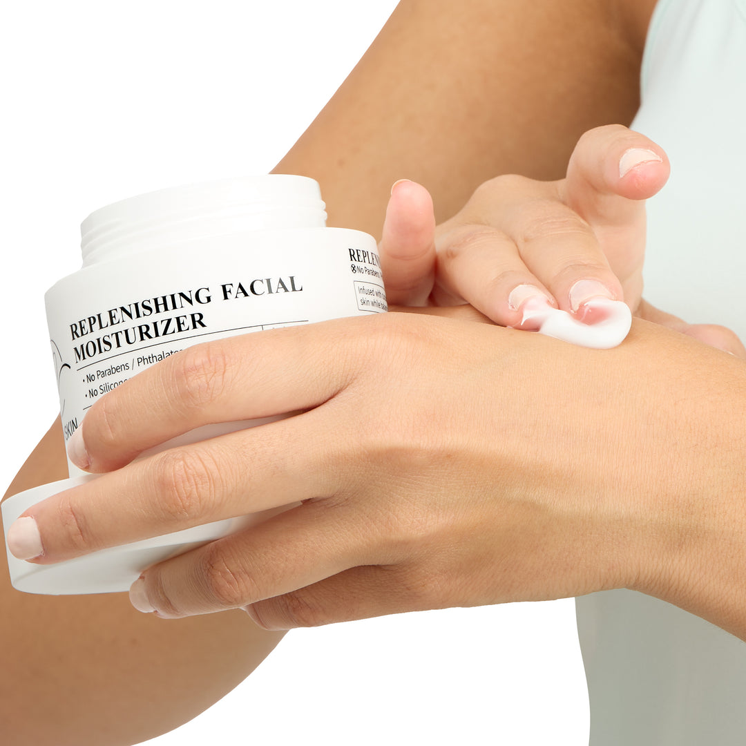 Curv Skin Replenishing Facial Moisturizer spread on hand showing creamy texture.